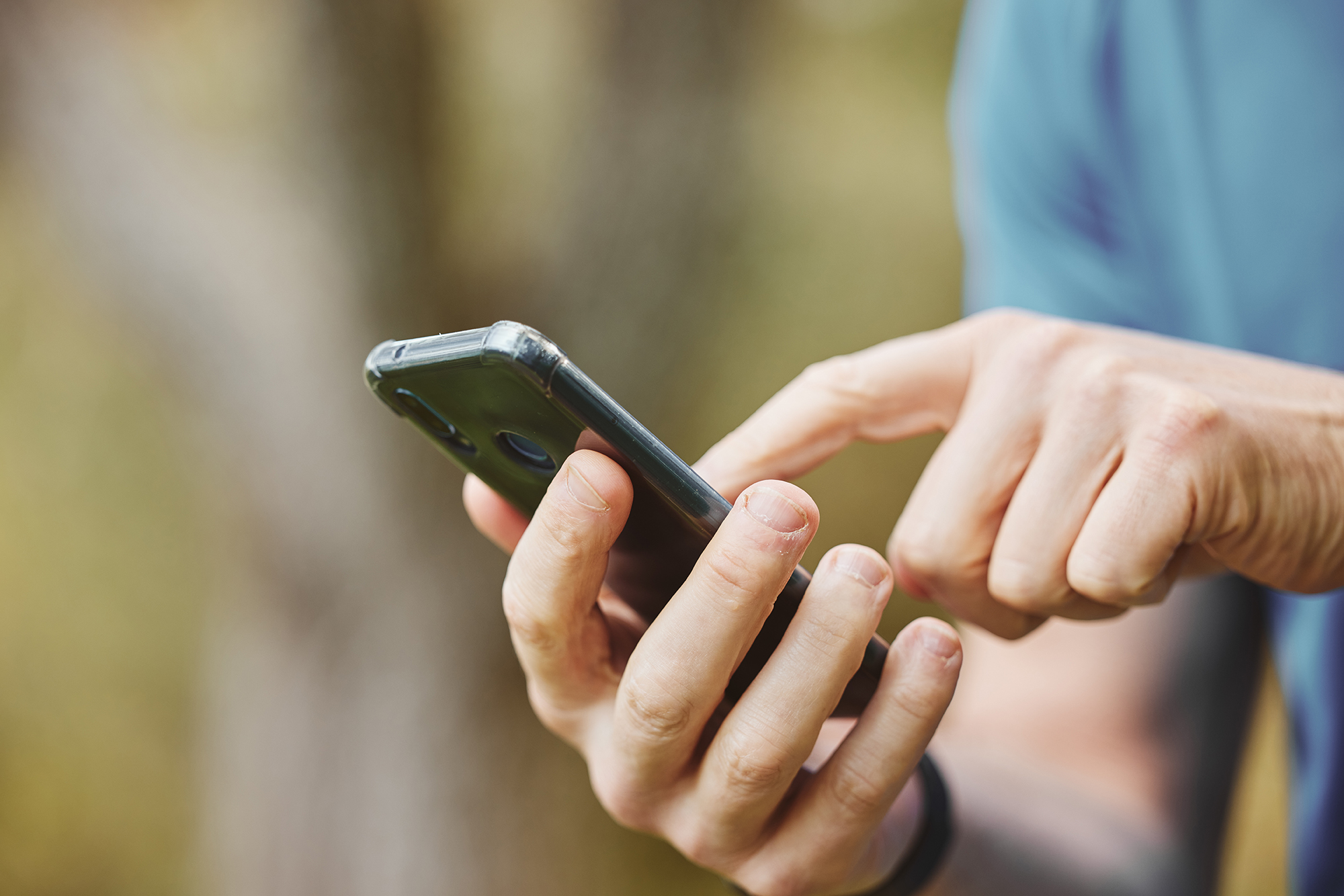 Hands, closeup and phone or outdoor exercise for fitness or location for training or communication. Runner, typing and health goal for workout app or reading screen for directions, wellness or sport